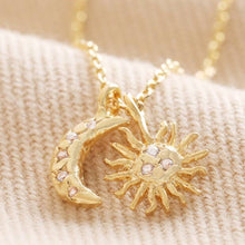 Load image into Gallery viewer, Gold Sun and Moon Charm Necklace featuring Cubic Zirconia